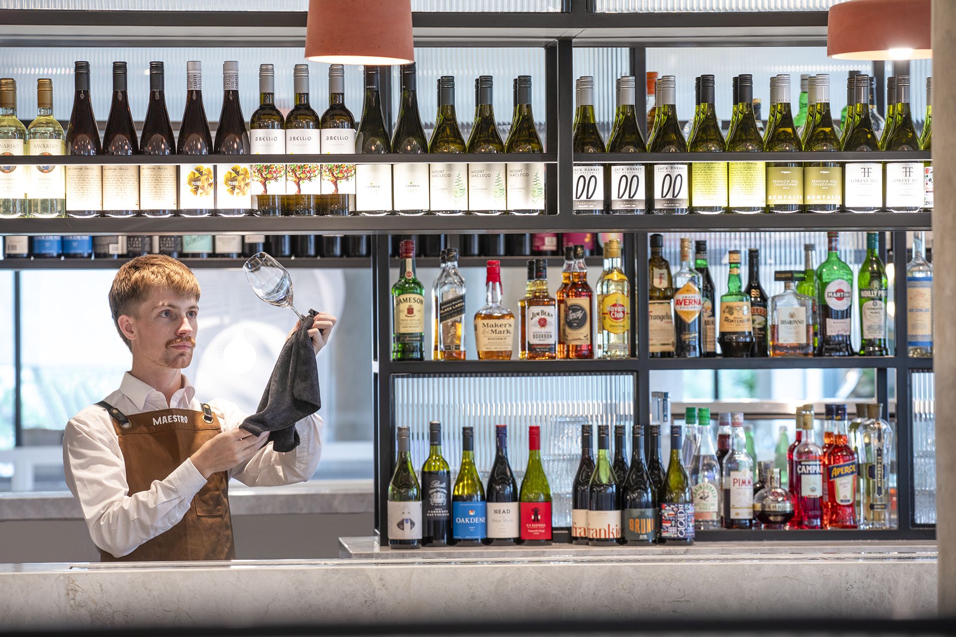 clothing, glove, adult, male, man, person, bar